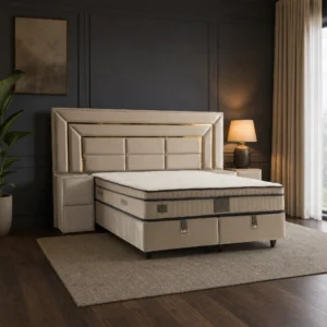 Luxury Gold Polsterbett mit überbreiter Kopfteilwand und goldfarbenen Zierleisten