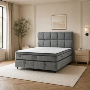 Puffy Gray Polsterbett in körnig meliertem Grau vor heller Wand